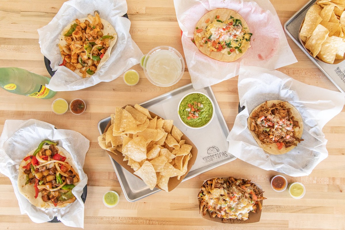 Kesos Tacos full spread — tacos, chips, queso and more