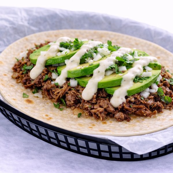 Barbacoa Tradicional — tender slow-cooked beef barbacoa, limited time at Kesos Tacos