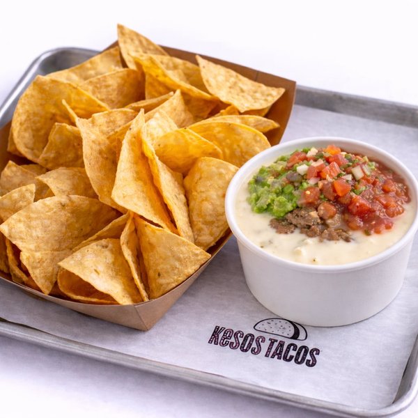 Don Keso — white queso topped with fresh guacamole, choice of meat, pico de gallo and Fire Red salsa with chips