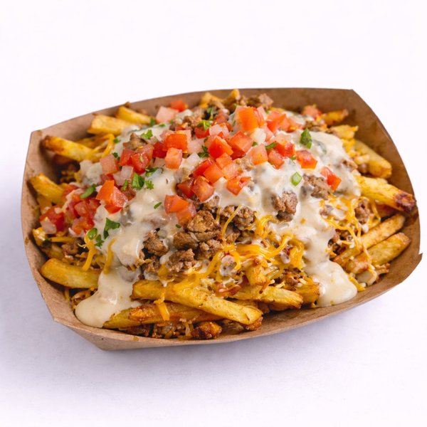 Keso Fries — fresh-cut fries loaded with white queso and your choice of toppings