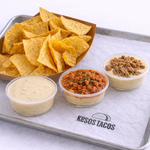 Queso Flight with three queso varieties — classic white, chorizo with Fire Red salsa, and Don Keso with carnitas