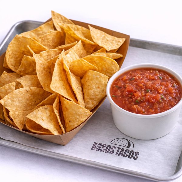 Roasted Red salsa with homemade tortilla chips at Kesos Tacos