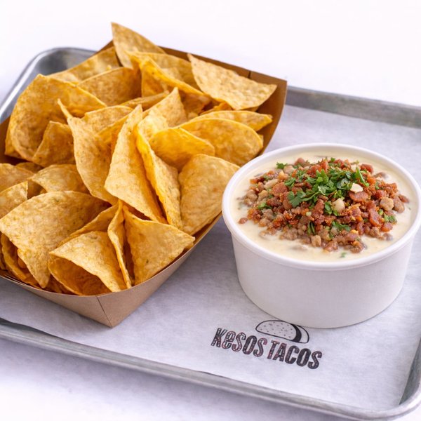 Triple Oinker Queso — creamy queso with carnitas, chorizo and bacon, limited time